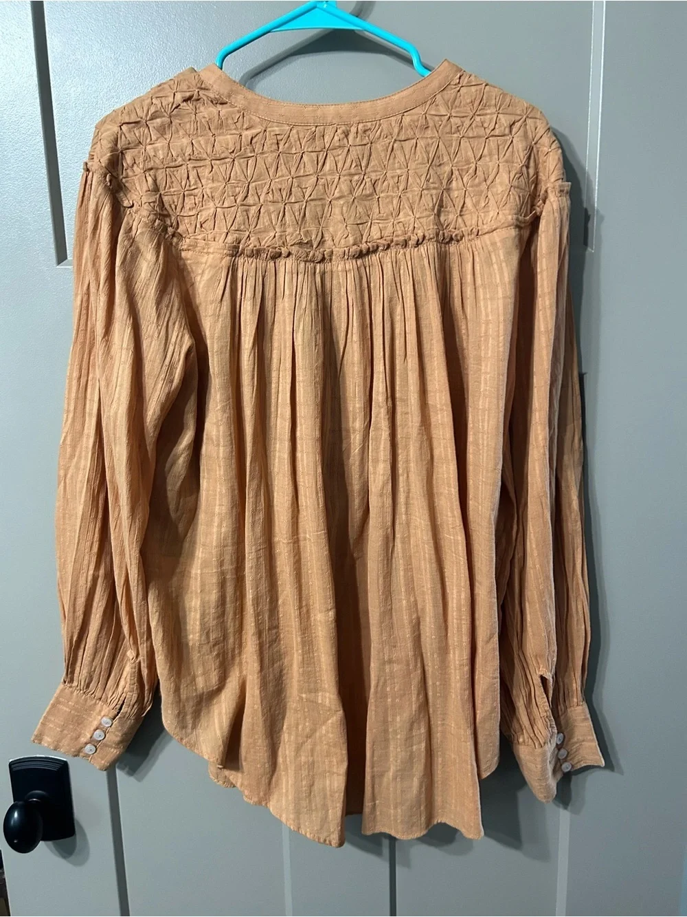 Free People Marigold Button Down Top in a burnt orange color